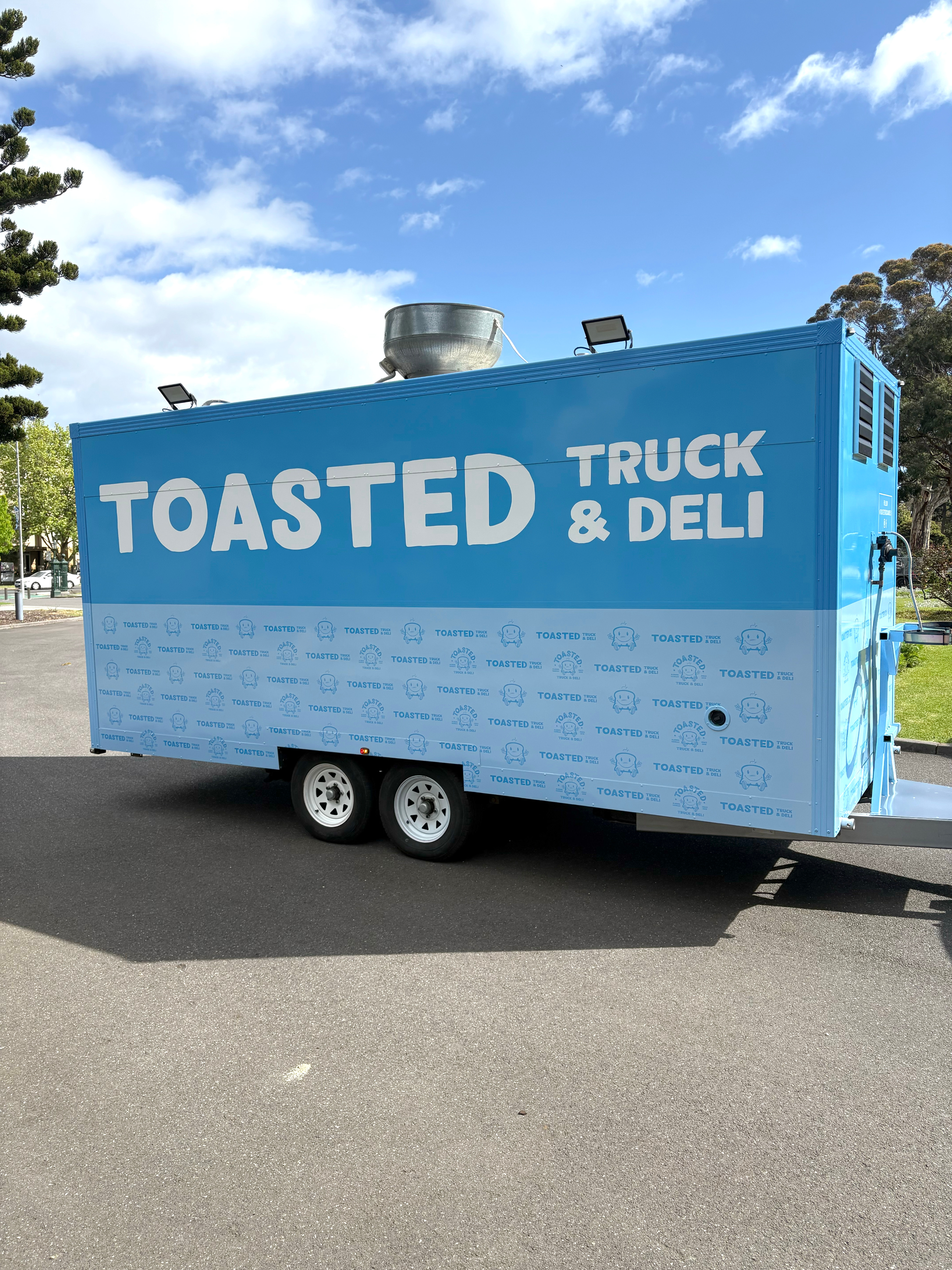 Graphic of a typography specimen showing the alphabet and numerals on top of a dark gray background.