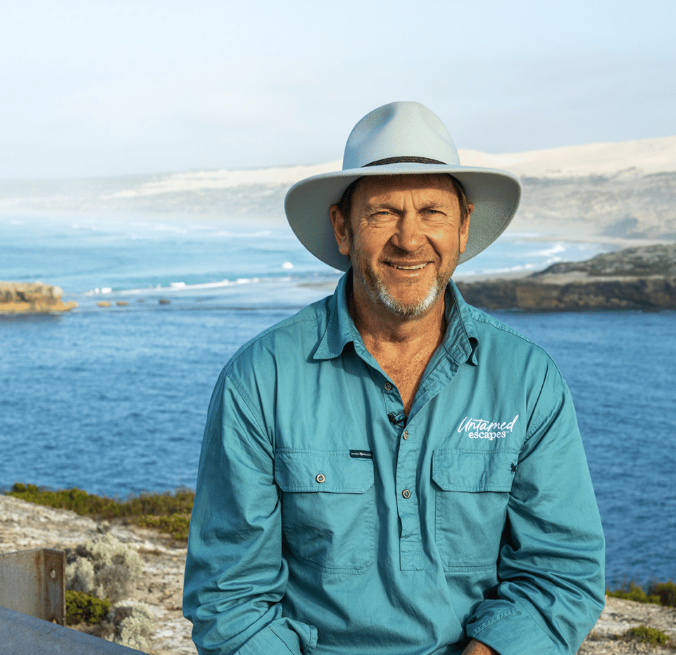 Graphic of a typography specimen showing the alphabet and numerals on top of a dark gray background.